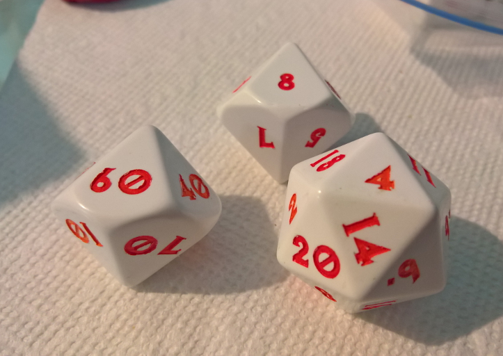 Examples of two D8s (eight-sided die) and a D20 (20-sided die) with a custom font